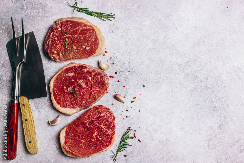 Fresh raw Black Angus beef steak on wooden board Fresh raw Black Angus beef steak on wooden board