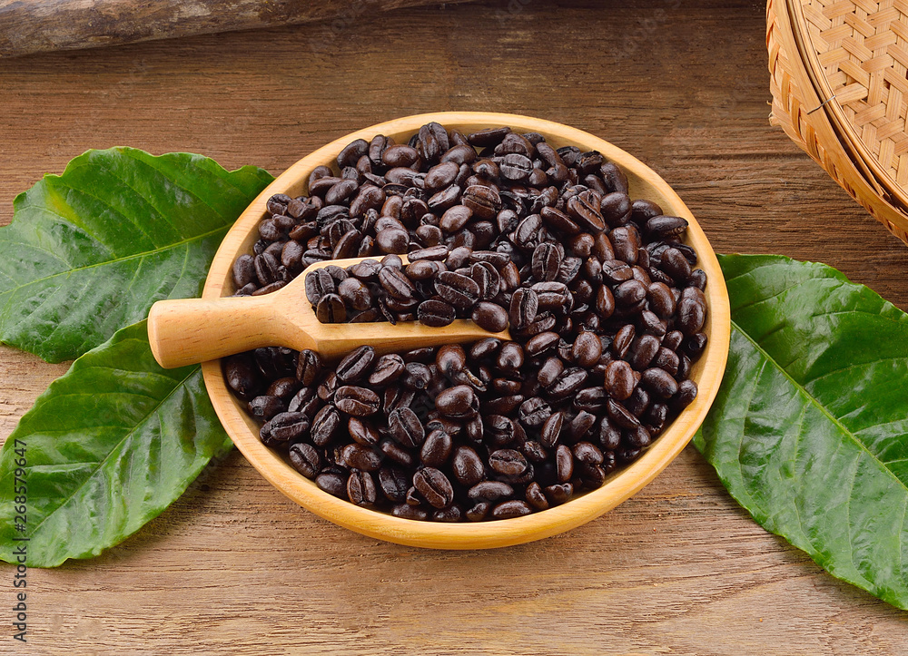 Coffee beans on a wooden background Coffee beans on a wooden background