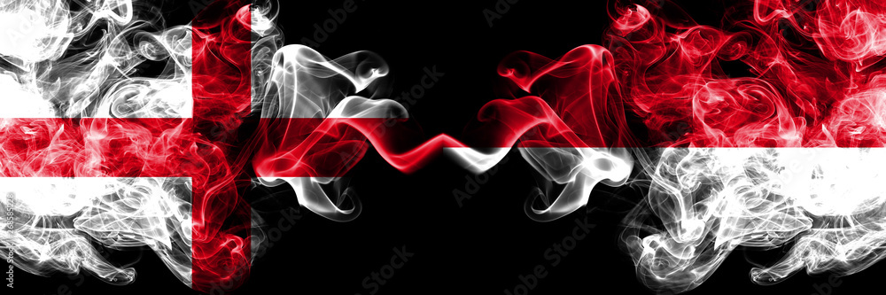 Obraz premium English vs Monaco, Monacan smoky mystic flags placed side by side. Thick colored silky smokes flag of England and Monaco, Monacan.