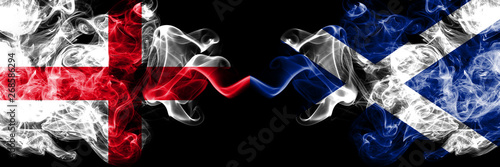English vs Scotland, Scottish smoky mystic flags placed side by side. Thick colored silky smokes flag of England and Scotland, Scottish.