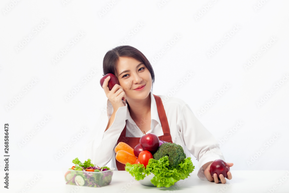 Asian young woman is happy holding fresh fruit apple with vegetables, Healthy, Fresh food, Clean eating recipes to fuel body from the inside out concept. Asian young woman is happy holding fresh fruit apple with vegetables, Healthy, Fresh food, Clean eating recipes to fuel body from the inside out concept.