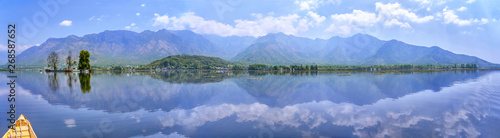Mountain panorama of Dal Lake with the shore and a beautiful island in Kashmir