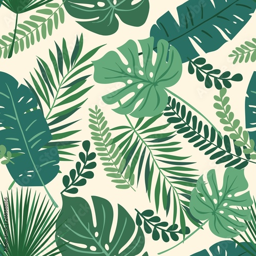 Tropical seamless repeat pattern with green leaves of different shapes overlapping on a cream background