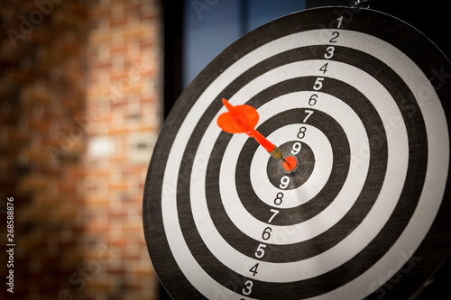 Red dart target arrow hitting on bullseye with Target marketing and business success concept - Image