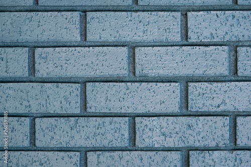 Blue outdoor painted brick wall