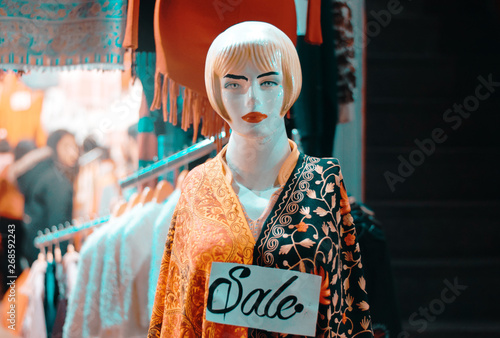 a woman object on sale in market dress shawl