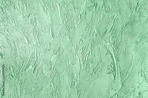 Trendy mint colored rouge concrete textured background for concept or product. Toned image.