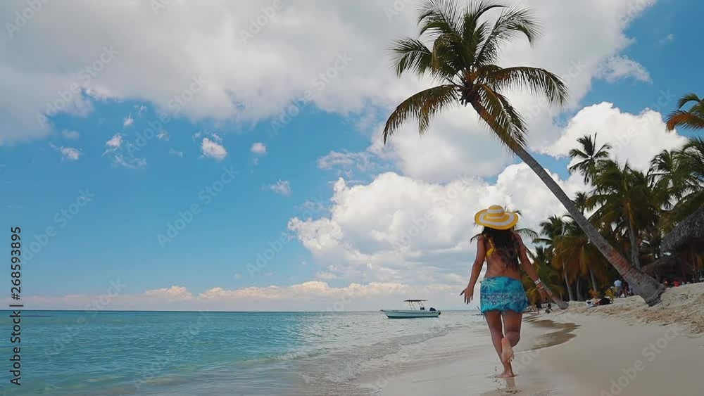 Happy carefree woman enjoying summer vacation in Saona Island and caribbean beaches, Dominican Republic Happy carefree woman enjoying summer vacation in Saona Island and caribbean beaches, Dominican Republic