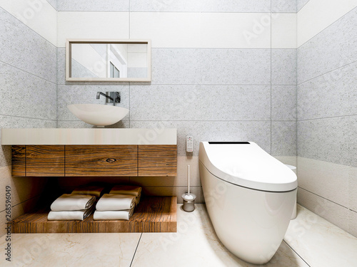 Modern bathroom in the home with smart toilet and shower, as well as sink and mirror photo