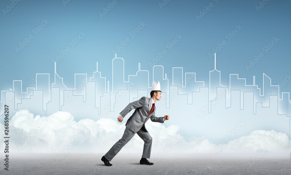 King businessman in elegant suit running and blue cityscape silhouette at background King businessman in elegant suit running and blue cityscape silhouette at background