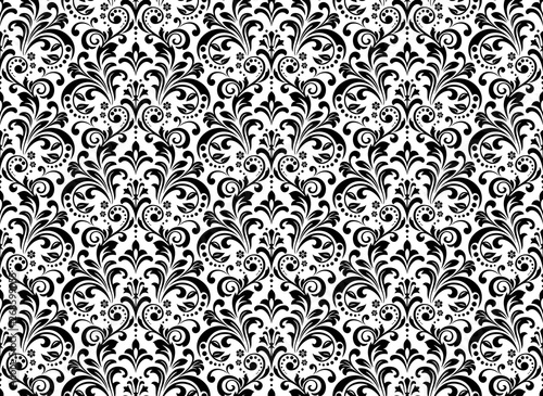 Wallpaper in the style of Baroque. Seamless vector background. White and black floral ornament. Graphic pattern for fabric, wallpaper, packaging. Ornate Damask flower ornament