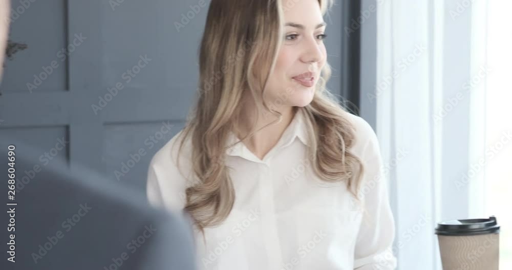 Business team discussing while having coffee Business team discussing while having coffee