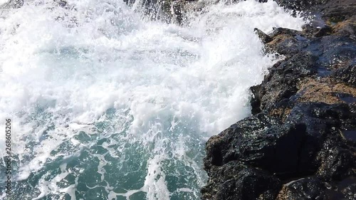 Burst of wave and sailsurfers photo