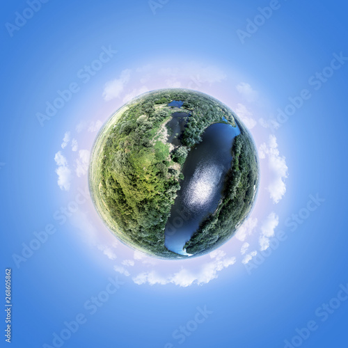 Small planet over blue sky (aerial photography) photo