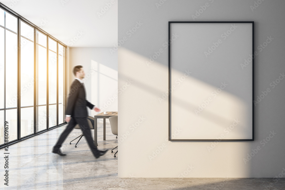 Businessman walking in modern meeting room Businessman walking in modern meeting room