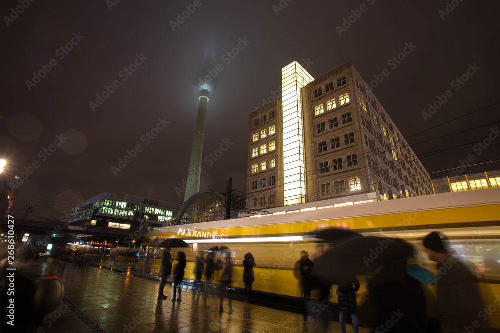 alexanderplatz berlin at night in the rain