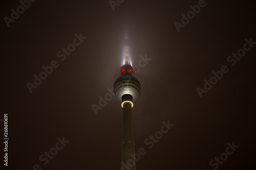 berlin tv tower in the fog at night