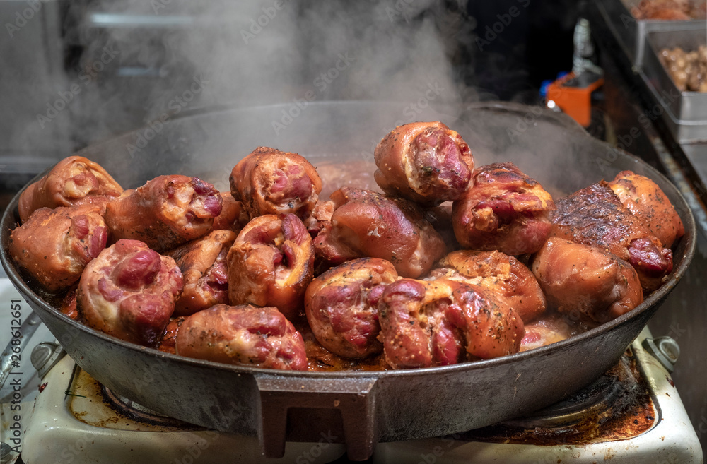 Roasted smoked pork legs for sale at christmas market. Krakow, Poland Roasted smoked pork legs for sale at christmas market. Krakow, Poland