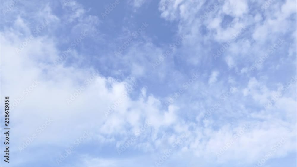 A time lapse of white clouds moving across a blue sky. A time lapse of white clouds moving across a blue sky.