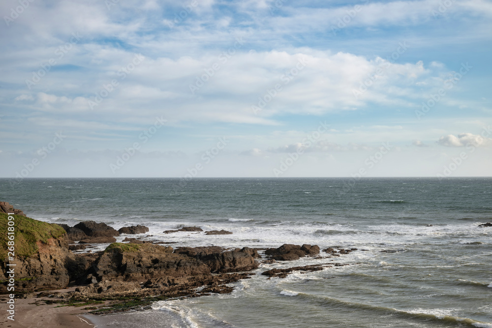 Stunning late evening Spring landscape image of Ayrmer Cove on Devon coastline in England Stunning late evening Spring landscape image of Ayrmer Cove on Devon coastline in England