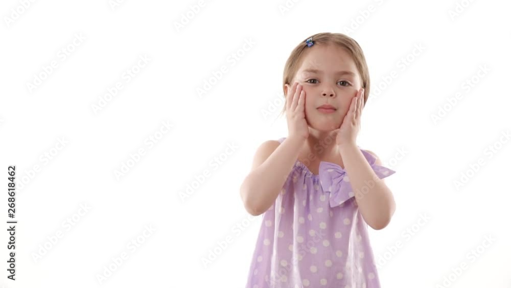 Video portrait of a surprised little girl isolated on white background. Childhood concept. Studio shot of child emotions in slow motion. Video portrait of a surprised little girl isolated on white background. Childhood concept. Studio shot of child emotions in slow motion.