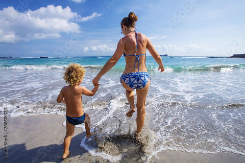 A family is having fun at the seashore © Maygutyak