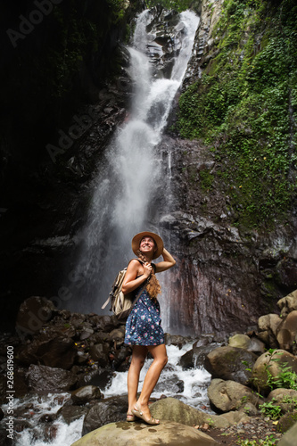 Woman near waterfal on Bali  Indonesia  