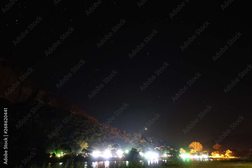 Village behind river at night, south africa Village behind river at night, south africa