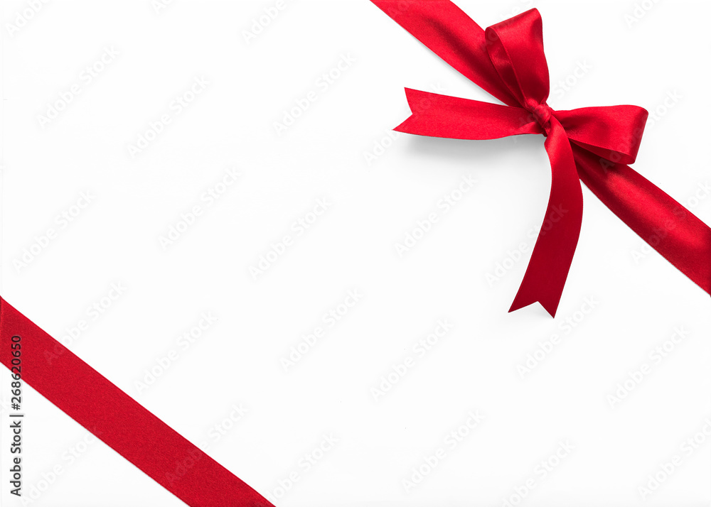 Red bow satin ribbon band stripe fabric on corner (isolated on white background with clipping path) for Christmas holiday gift box present wrap design decoration ornament element Red bow satin ribbon band stripe fabric on corner (isolated on white background with clipping path) for Christmas holiday gift box present wrap design decoration ornament element