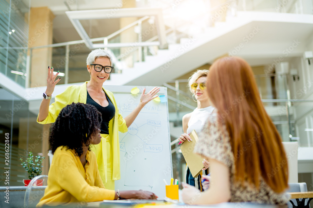I have a great idea. excited blond woman with raised arms talking something.successful plan. happy women have solved business problem I have a great idea. excited blond woman with raised arms talking something.successful plan. happy women have solved business problem