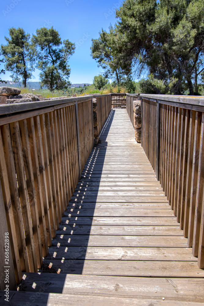 Tourist wooden bridge in the ancient city of National Park Zippori. Israel.