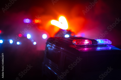 Police cars at night. Police car chasing a car at night with fog background. 911 Emergency response pSelective focus © zef art