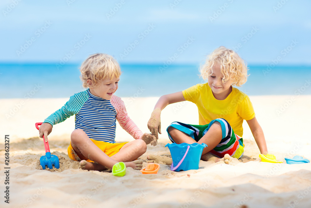 Kids playing on beach. Children play at sea.