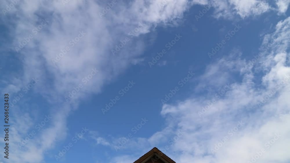 capricious clouds passing above the roof capricious clouds passing above the roof