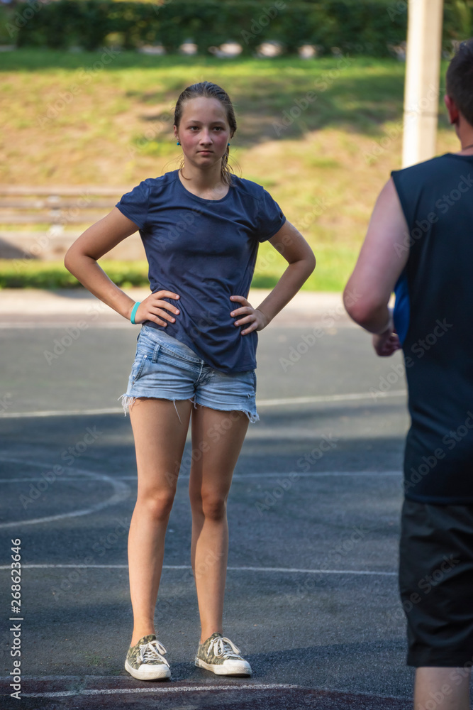 Portrait of teen girl on playground in summer park. Portrait of teen girl on playground in summer park.