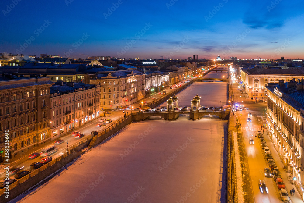 Aerial view on Lomonosov Bridge over the Fontanka River in St. Petersburg. Winter night. Aerial view on Lomonosov Bridge over the Fontanka River in St. Petersburg. Winter night.
