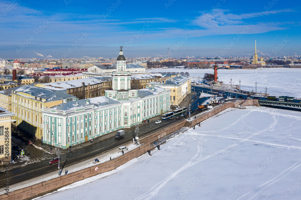 aerial view from drone Kunstkammer, Rostral column, Peter and Paul Fortress and the Palace Bridge across the Neva River in St. Petersburg