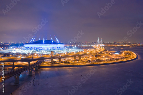 The bridge across the strait. The Gulf of Finland. Saint Petersburg. Highway in the evening. Evening city. Russia. The road leading to the island. Krestovsky Island in St. Petersburg. photo