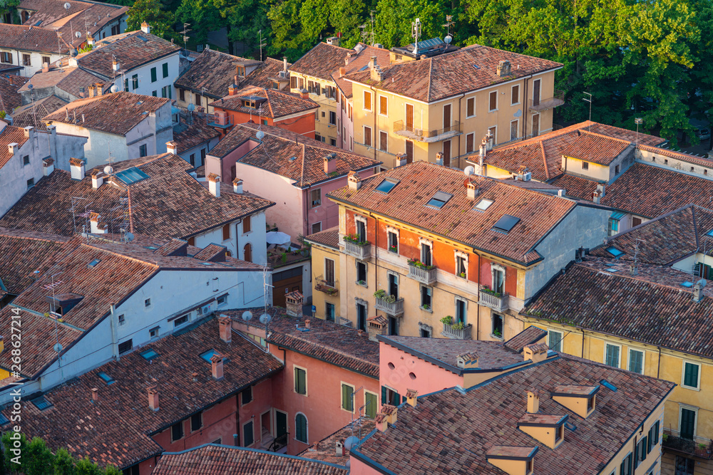 view from above of the roofs of houses in the central part of Verona, Italy.