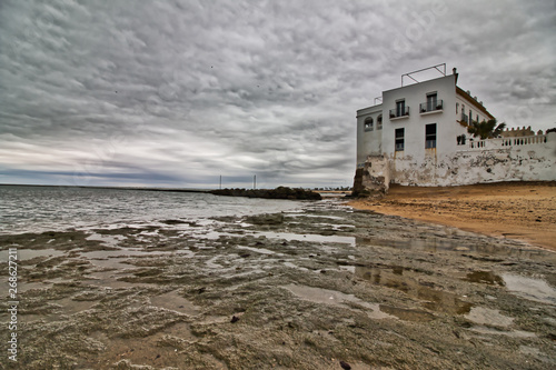 Dramatic landscape of Chipiona beach, in the province of Cadiz, Spain, on a cloudy day