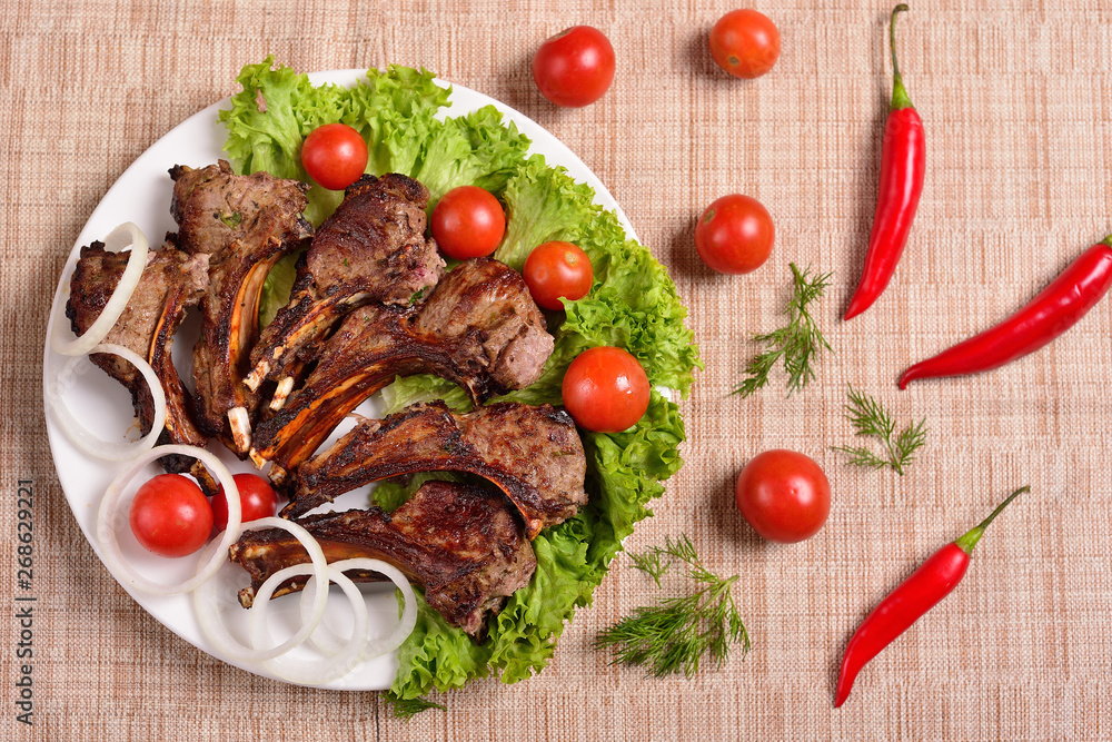 barbecue on a plate with herbs and vegetables. Russian restaurant. The concept of the menu. Top view. barbecue on a plate with herbs and vegetables. Russian restaurant. The concept of the menu. Top view.