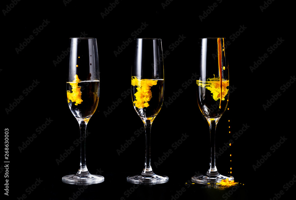 Color splashes in champagne glasses Color splashes in champagne glasses