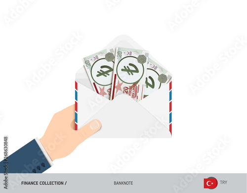 20 Turkish Lira Banknotes in envelope hold in hand. Flat style opened white envelope with cash. Salary payout or corruption concept.
