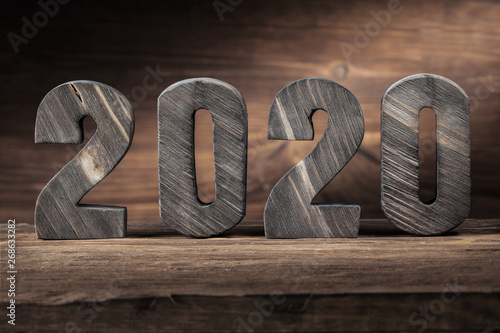 2020 new years wood letters on wooden background photo