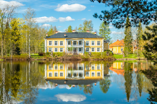 Kouvola, Finland - May 16, 2019: Beautiful wooden Rabbelugn Manor - Takamaan Kartano. Wrede family house was built in 1820 on the river Kymijoki bank.