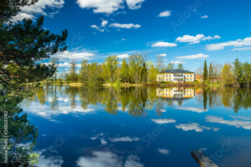 Kouvola, Finland - May 16, 2019: Beautiful wooden Rabbelugn Manor - Takamaan Kartano. Wrede family house was built in 1820 on the river Kymijoki bank. photo