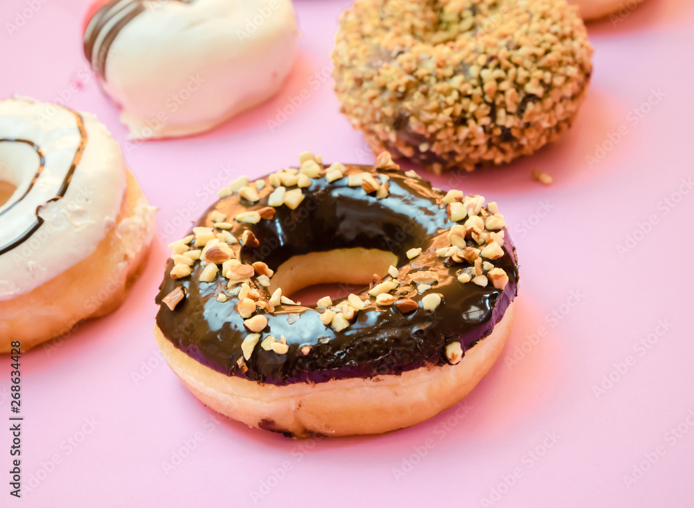 Donuts assorted with glazed on blue and pink background Donuts assorted with glazed on blue and pink background