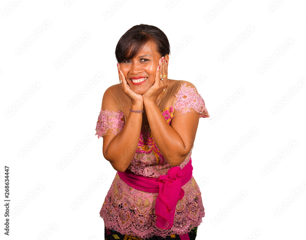beautiful middle aged 40s Indonesian Balinese woman in traditional religious ceremony dress smiling cheerful on isolated background in welcome to Bali Hindu religion beautiful middle aged 40s Indonesian Balinese woman in traditional religious ceremony dress smiling cheerful on isolated background in welcome to Bali Hindu religion