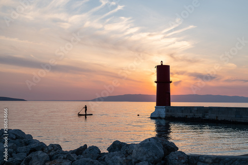 Sunset behind the red lighthouse in Cres