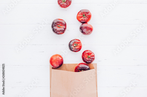 Tomatoes Mar Azul on white wooden table background